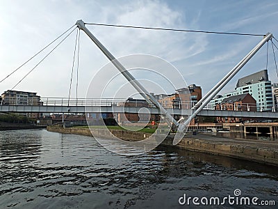 Knights bridge crossing the river aire in leeds with surrounding riverside apartments Stock Photo