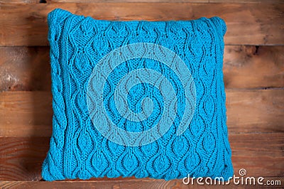 Knitted blue pillow Stock Photo