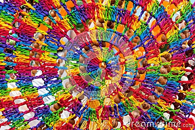Knitted cobweb of multi-colored threads. Background of bright threads. Stock Photo
