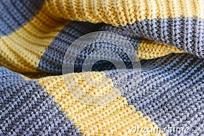 Knitted fabric large knitted yellow with grey stripes horizontally. Stock Photo