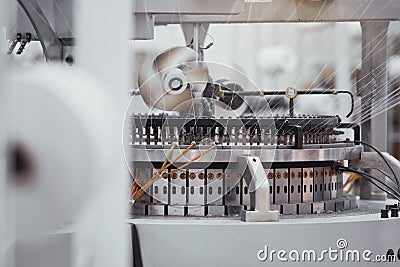 Knitted fabric. Textile factory in spinning production line and a rotating machinery and equipment production company Stock Photo