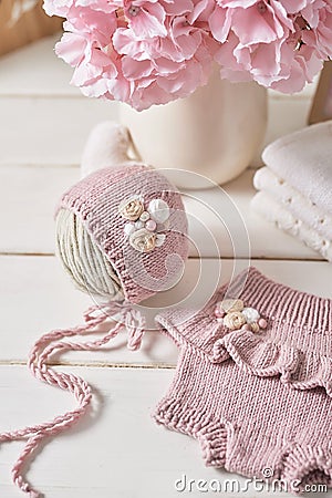 Knitted kids clothes and accessories for knitting. Needlework and knitting. Hobbies and creativity. Knit for children. Handmade Stock Photo