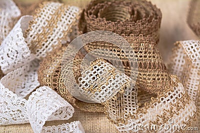 Knitted openwork linen ribbon tapes in rural style of rustics cotton eco natural Stock Photo