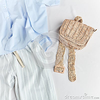 Knitted purse, clutch, wallet aand striped pants and blue blouse Stock Photo