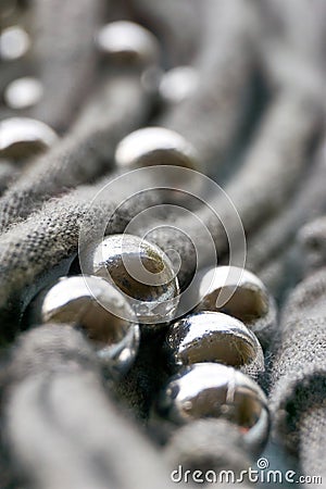 Knitted threads with silver coloured beads Stock Photo