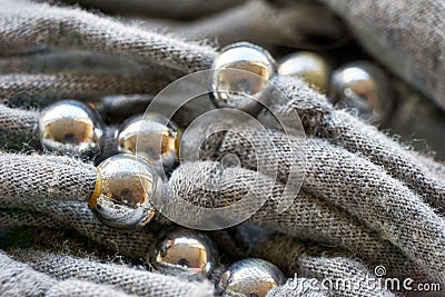 Knitted threads with silver coloured beads Stock Photo