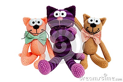 Knitted toys - striped embraced cats. Stock Photo