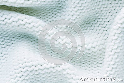 Knitted white fabric texture with large fold, reverse stockinette stitch Stock Photo