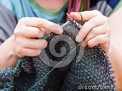Knitter knits pullover from wool Stock Photo