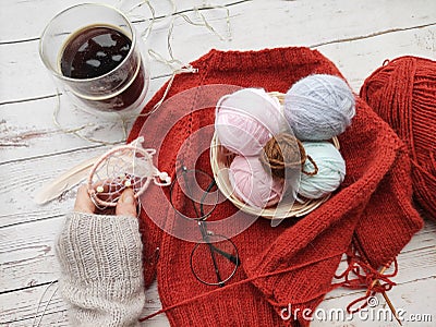 Knitter's table, morning coffee and unfinished knitting project Stock Photo