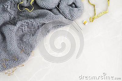 Grey knitwork on marble background Stock Photo