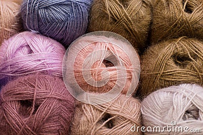 Knitting needles, colorful threads, beige colors Stock Photo