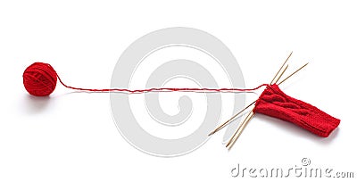 Knitting a red yarn ball with noodles Stock Photo