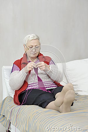 Knitting senior woman Stock Photo