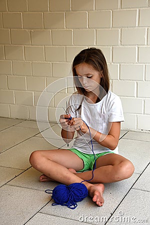 Knitting teenager girl Stock Photo