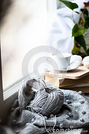 knitting on the window of a cup of coffee book hobby handmade Stock Photo