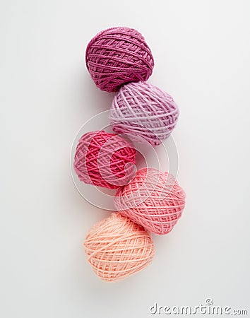 Knitting yarn balls in pink tone. Stock Photo