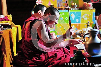 Knock a gong Monk Editorial Stock Photo