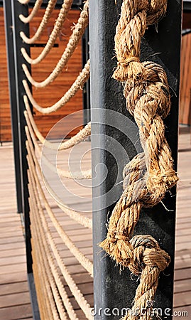 Knots on the rope. Ropes attached to iron beams. Stock Photo