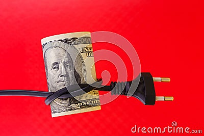 Knotted electric cord around the neck of the president of the dollar bill, selective focus. Concept of the energy crisis Stock Photo