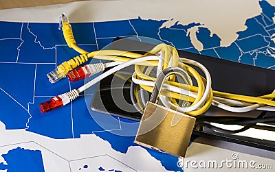 knotted net cable around a padlock over a US map Stock Photo