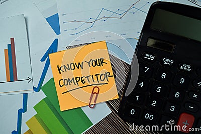 Know Your Competitor write on sticky notes with graphs and diagram isolated on office desk Stock Photo