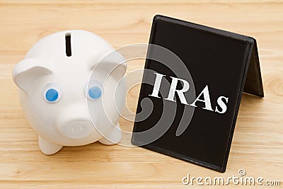 Knowing your IRA options with piggy bank Stock Photo