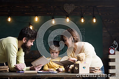 Knowledge concept. Little child learn reading books, knowledge. Knowledge assimilate better with family love. Reading Stock Photo