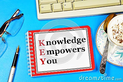 Knowledge empowers you. Text placemark in the planning Notepad. Stock Photo