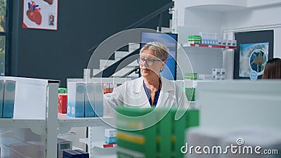 Knowledgeable pharmacist in dispensary Stock Photo