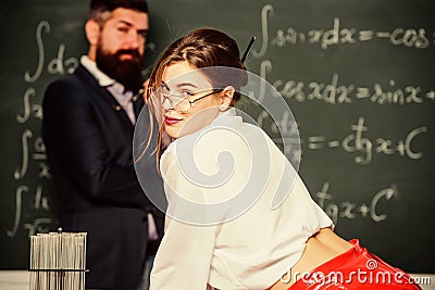 She knows what she want. Full ideas. Teacher and attractive student. Provocation concept. Private lesson. Flirting with Stock Photo