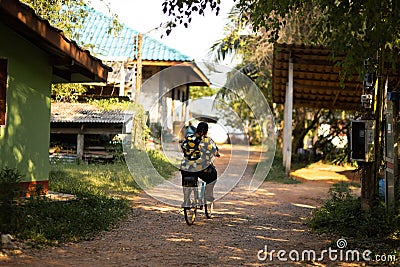 KO CHANG, THAILAND - APRIL 10, 2018: Authentic traditional fishermen`s village on the island - People and children in Editorial Stock Photo