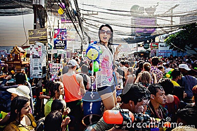 KO SAMUI, THAILAND - APRIL 13: Unidentified girl shooting water at the camera on Songkran Festival Editorial Stock Photo