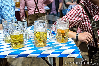 Koblenz Germany 27.09.2019 Close-up of bavarian beer glasses 1 liter bitburger Beer on table decoation at Octoberfest Editorial Stock Photo