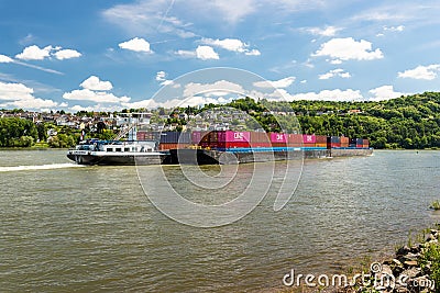 Koblenz, Germany - 1 June 2019. Two connected barges carrying a lot of containers on the Rhine River in western Germany in Koblenz Editorial Stock Photo