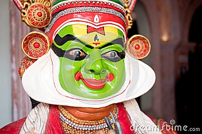 Kochi, India - 20 september 2019: close upof kathakali actor acting with sringara expression and applying make up before a Editorial Stock Photo