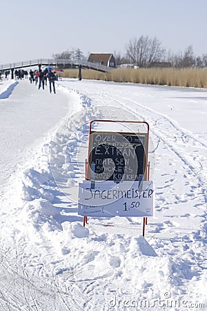 `Koek en Sopie` blackboard in the snow Editorial Stock Photo