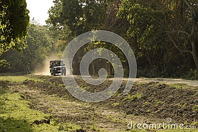 tourist safari vehicle moves along the unpaved road Editorial Stock Photo