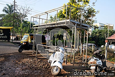 Stock photo of empty local bus stop or bus station or bus stand, vehicle parked around bus stop Editorial Stock Photo