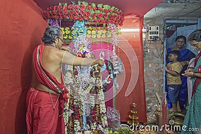 Hindu priest worshipping Goddess Kali Editorial Stock Photo