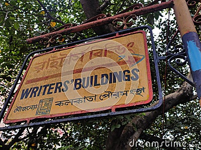 Old metallic street sign board placed on the pole outside the haunted Writers building in Calcutta. Editorial Stock Photo