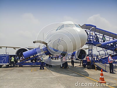 Passengers are boarding Indigo flight at Kolkata air port. Blue sky and white cloud Editorial Stock Photo