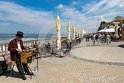 Kolobrzeg, zachodniopomorskie / Poland - May, 21, 2019: Pier in a holiday resort by the sea. A place of rest in Central Europe. Editorial Stock Photo