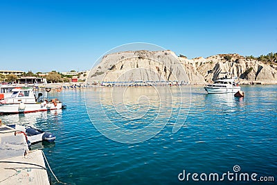 Kolymbia beach with umbrellas, sunbeds and boats Rhodes, Greece Stock Photo