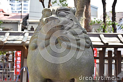 Portly Komainu Statue at Japanese Shrine Stock Photo