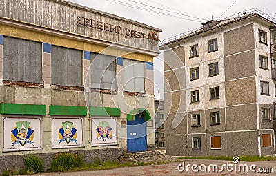 Komsomolsky, Russia. July 14, 2021. Old empty houses in the abandoned settlement of Komsomolsky. Closed shop. Vorkuta Editorial Stock Photo