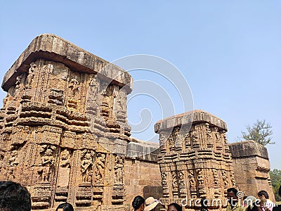 Rock idol with old statues in ancient Hindu temple. Beautiful positions of Kamasutra carved on sandstone. Editorial Stock Photo