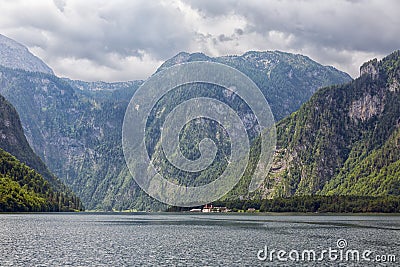 Konigssee near German Berchtesgaden surrounded with vertical mountains Stock Photo