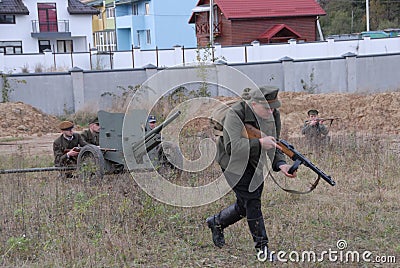 Ukrainians reenact a battle between the Ukrainian Insurgent Army UPA and the Red Army as they mark the `Day of defender` Editorial Stock Photo