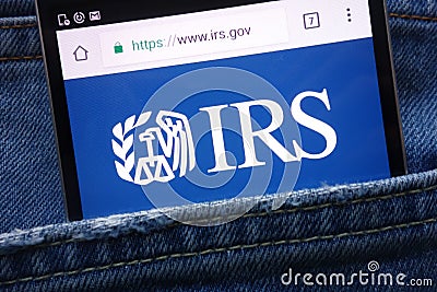 IRS Internal Revenue Service website displayed on smartphone hidden in jeans pocket Editorial Stock Photo